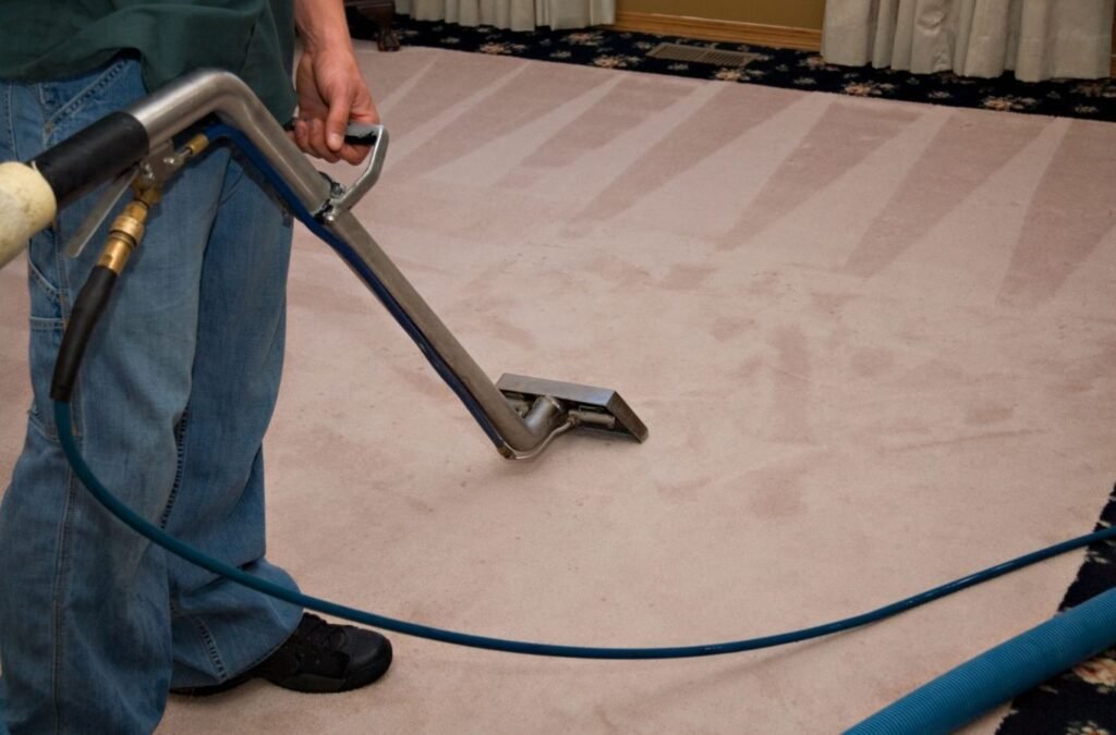 A Green and Clean Home Services technician showcasing eco-friendly carpet cleaning methods in Mentor, Ohio.