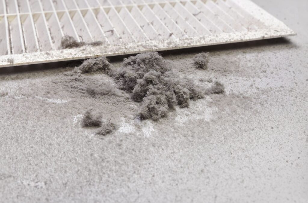 A Green and Clean Home Services technician improving air quality by cleaning air ducts in Chardon, Ohio.