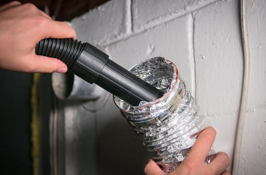 A Green and Clean Home Services professional cleaning air ducts in Chardon, Ohio. Air Duct Cleaning Near Me.