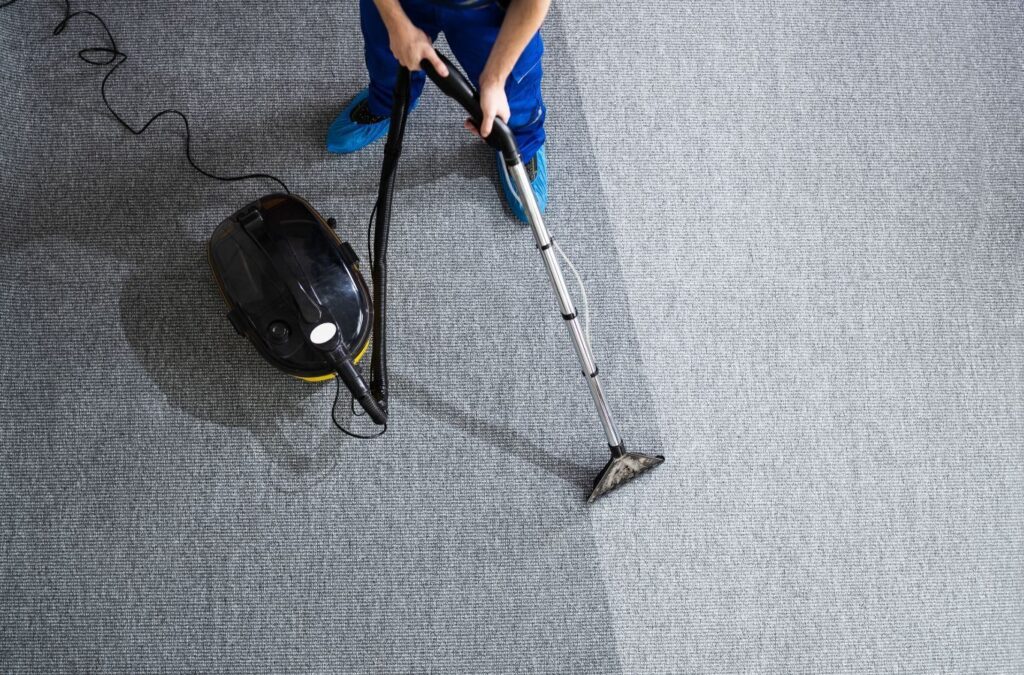 A Green and Clean Home Services technician restoring carpet freshness and appearance in Chardon, Ohio. Carpet Cleaning Near Me.