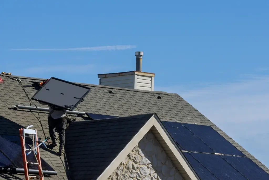 work man installing photovoltaic solar panels alte